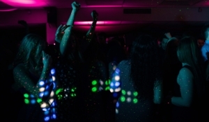 Galentines DancePowered Party shows an image of a night club with disco lights and dancing